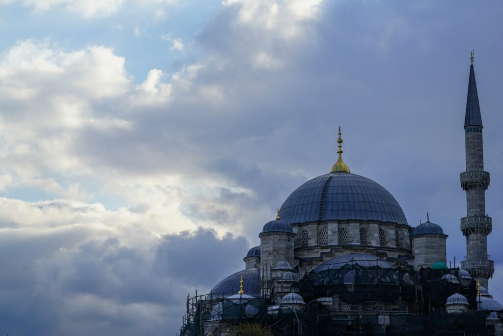 white and blue dome building under white clouds during daytime